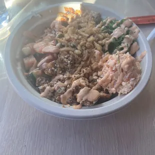 Freestyle Bowl - spicy tuna, salmon, shrimp, crab mix, seaweed salad, crispy onion, and sriracha mayo.