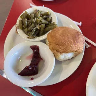 Green beans, roll and the tiniest amount of cranberry sauce I've ever seen