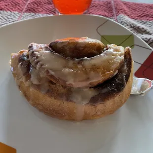 Imagine the biggest homemade cinnamon role ever! Ooey and gooey icing on top. Amazing!!! A must get.