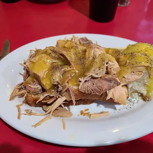 a plate of food on a red table