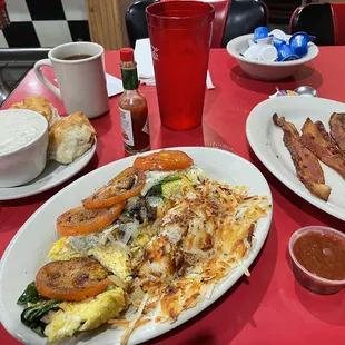 Garden omelette substituted with real eggs, hash browns, bacon, and biscuits with gravy