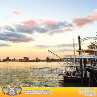 Sunset on the Mississippi River with an old-world paddle wheeler in the foreground. Ah... ain't it beautiful!