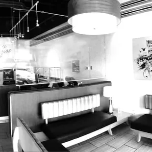 a black and white photo of a restaurant