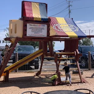 Play structure. There was a heavy rain last night so there is still a bit of water standing. Bring extra clothes.