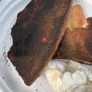 Burnt crust. Top wasn&apos;t much better, but kids ate the cheese because they were hungry.