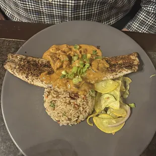 Blackened redfish with pecan rice pilaf and vegetable medley