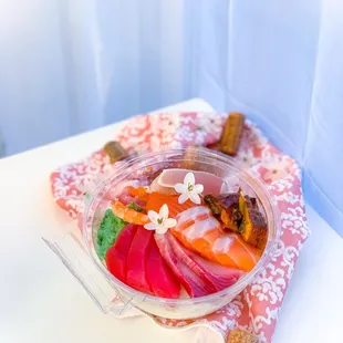 Chirashi in their take out bowl