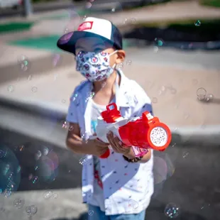 My son enjoying his bubble  gun