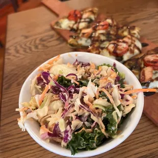 Chicken flat bread and side of coleslaw salad