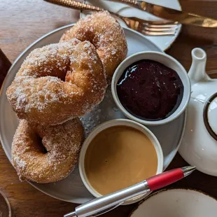 Moroccan donuts, with berry sauce and caramel sauce. Massive!! Pen included in the photo is for scale.