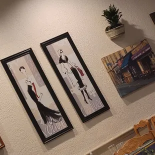 a woman sitting at a table in a restaurant