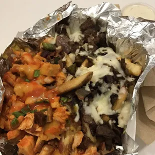 Loaded buffalo chicken fries and cheese steak fries