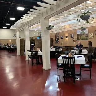 a dining room with tables and chairs