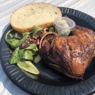 Quarter rotisserie chicken with bread and basil butter. So good!