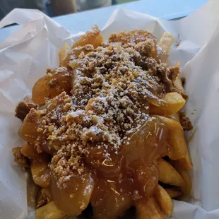 Warm Cinnamon Apples over Sweet Potato fries topped with Granola and Caramel