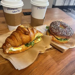 croissant w/egg, smoked salmon, and avocado (left) and crogel (croissant/bagel hybrid) with egg, smoked salmon, and avocado (right).