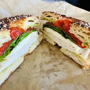 Cro'gel and roasted chicken sandwich with mozzarella, basil, pesto and tomatoes.