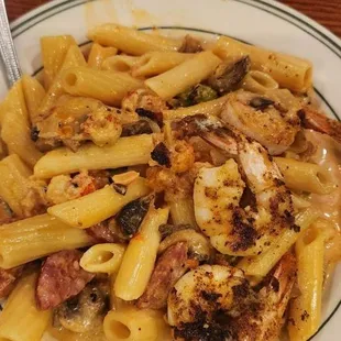 Cajun pasta with shrimp sausage and crawfish tails. It&apos;s good and was very hot and stayed warm for the whole meal.