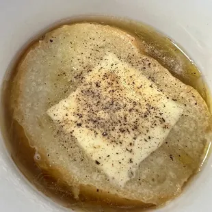 a square of butter in a bowl
