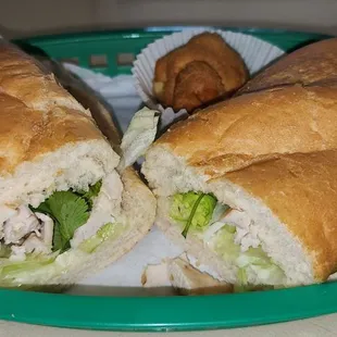 S1, sliced grilled chicken breast, house mayo, lettuce, cucumber, tomato, &amp; cilantro on French bread.   came with a delicious cream puff.