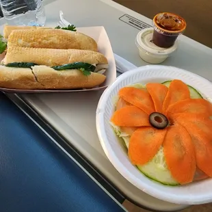 Continental sandwich with beautiful salad and a cream puff