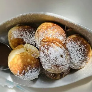 Aebleskivers with caramel dipping sauce.