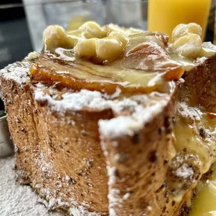 The bomb!!  "Coconut cream stuffed French Toast with brulèed pineapple, lemon curd, and candied mac nuts" and Chicken Waffle !!!