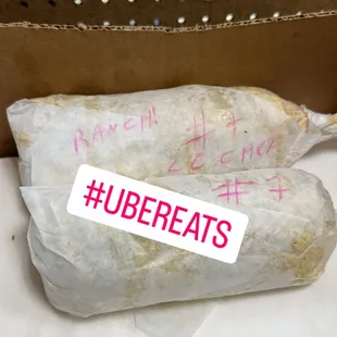a burrito wrapped in paper