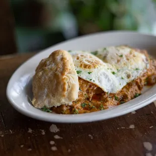 Biscuits with spicy chorizo gravy, topped with fried eggs