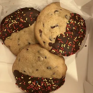 three chocolate chip cookies with sprinkles