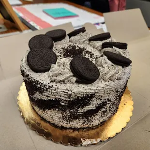 a cake with oreo cookies on top