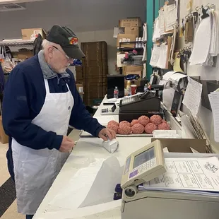 Making the ground meat for meatballs, or meatloaf.