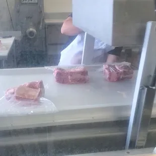 a butcher cutting meat