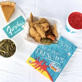 a plate of fried chicken and a book