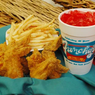 a plate of chicken nuggies, fries and ketchup