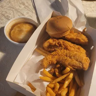 Mashed potatoes, chicken tender order with fries and roll