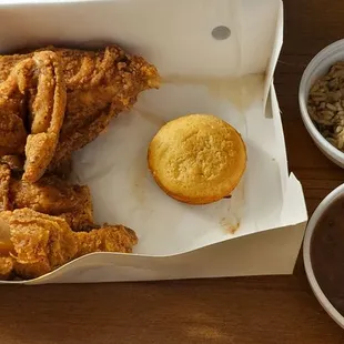 a basket of fried chicken and a cup of coffee