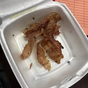 bacon in a styrofoam container