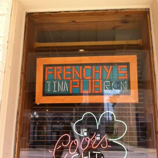 a neon sign in the window