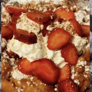 Strawberry and whipped cream funnel cake.