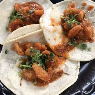 Tamarind shrimp tacos and a drink $8