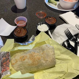 BYO burrito. Chicken, black beans, rice, onion, cilantro, lettuce. Salsa/sour cream on side. Decent but bland. Chipotle is way better!