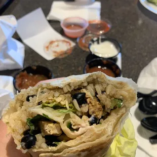 BYO burrito. Chicken, black beans, rice, onion, cilantro, lettuce. Salsa/sour cream on side. Decent but bland. Chipotle is way better!