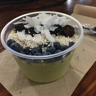Matcha avocado bowl with blueberries, blackberries, coconut and amareth.