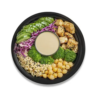 a plate of food with broccoli, tofu, chick, and chickpeas