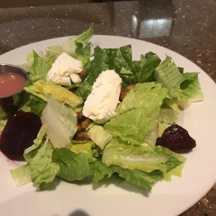 Beet salad that is a salad and not a big salad but is a big salad that is supposed to have arugula but they ran out so it has romaine