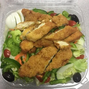 a salad in a plastic container