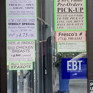 a window with a sign for the store