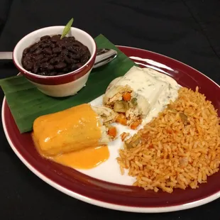 G.T.O. TAMALE w/ spicy roasted tomato cream sauce- Oaxacan black beans &amp; Mexican rice