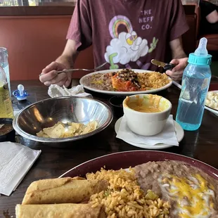 Chips and Queso* Brisket Taquito Dinner Enchilada
